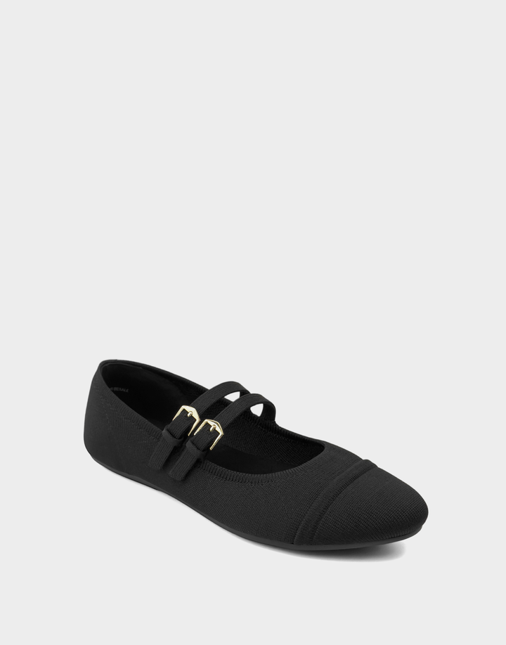 Angled shot of the Aerosoles Brit black knit flat showing the sleek slip-on silhouette and textured fabric design.