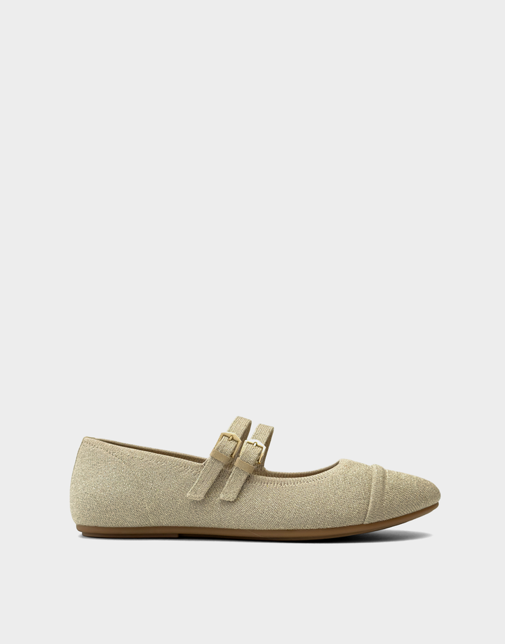Side profile of the Aerosoles Brit ballet flat in Soft Gold metallic knit featuring dual Mary Jane straps with gold-tone buckles.