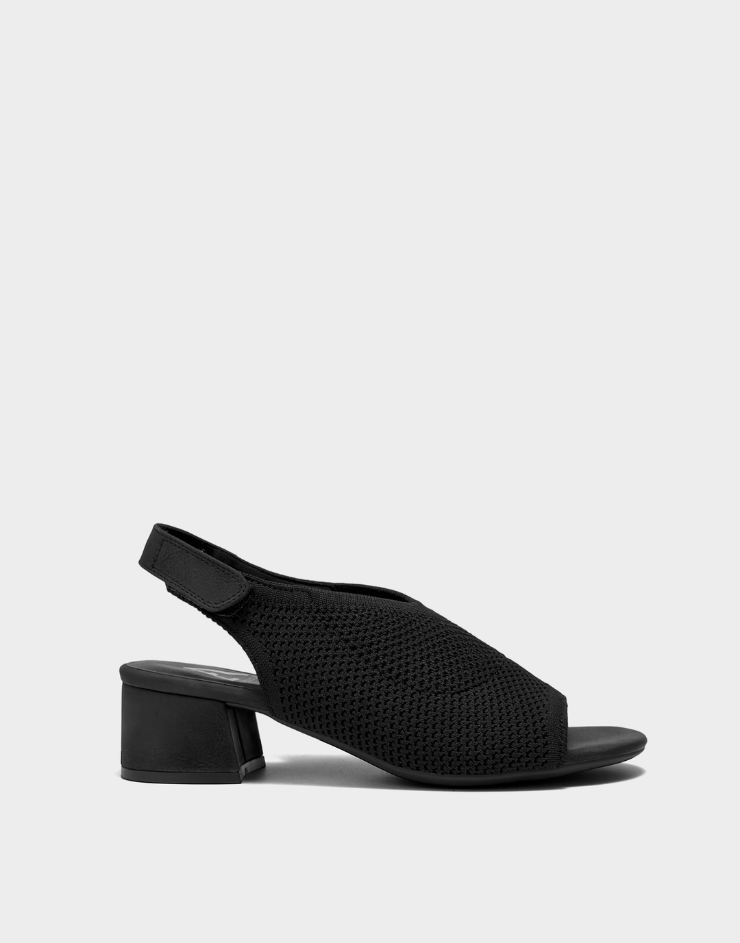 Side profile of the Aerosoles Costi block heel in black knit featuring a walkable chunky heel and flexible slip-on silhouette.