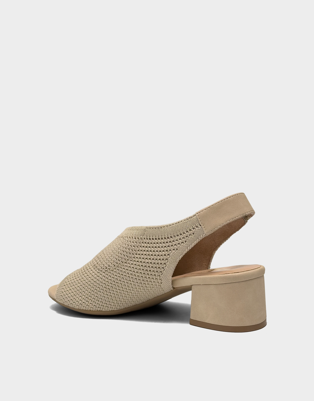 Lateral side view of the Costi block heel in Soft Gold Knit highlighting the low-profile construction and flexible comfort collar.