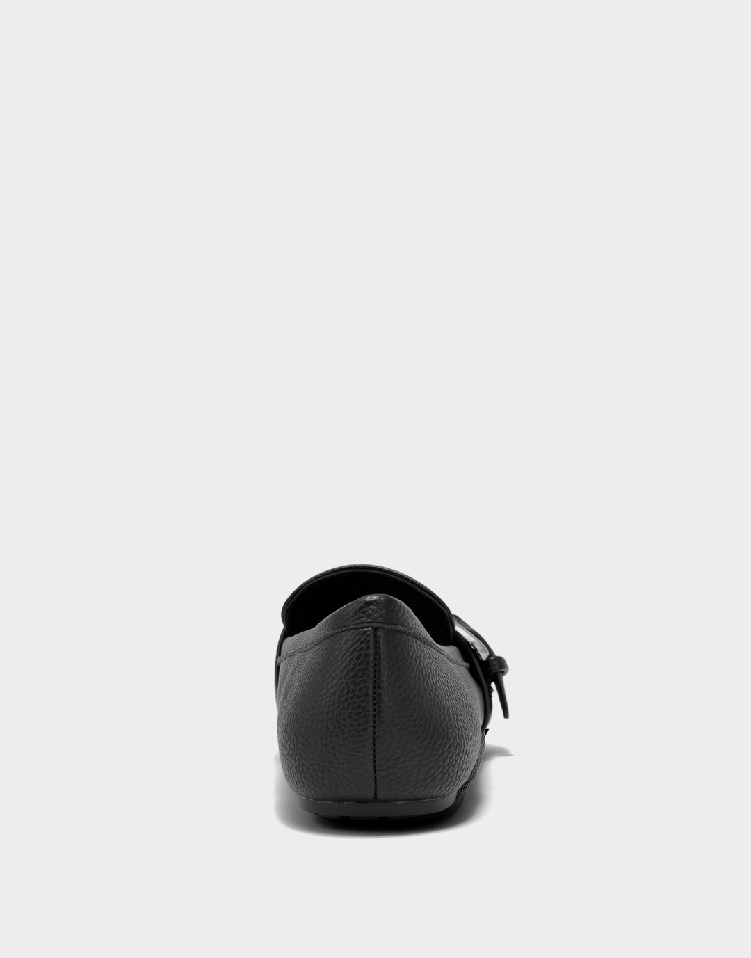 Rear view of the Aerosoles Dinetta loafer in black faux pebbled leather showcasing the supportive heel counter and clean silhouette.