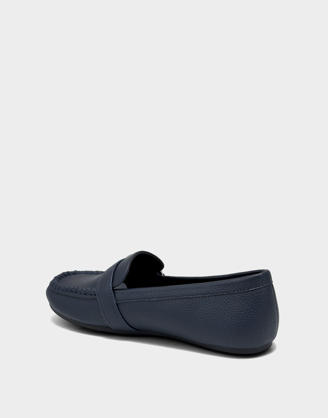 Lateral view of the Dinetta navy slip-on loafer highlighting the Stitch 'N Turn construction for out-of-the-box flexibility.