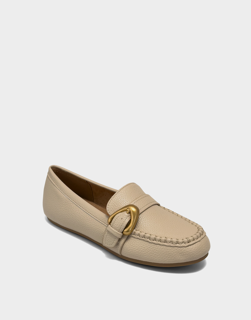 Angled view of the Aerosoles Dinetta stone loafer showcasing the classic round toe and light neutral pebbled texture.