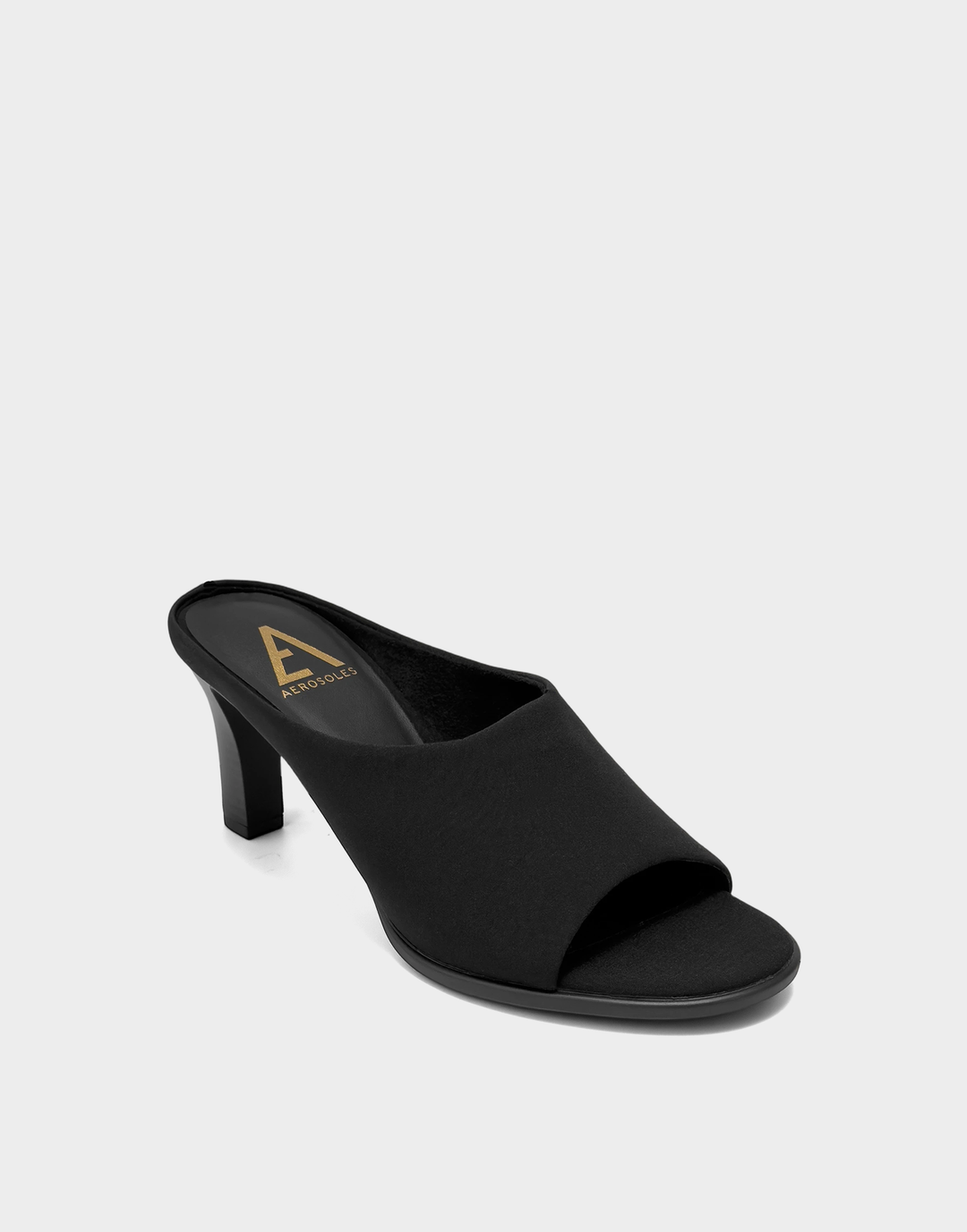 Angled shot of the Aerosoles Hali black sandal showcasing the flexible 100% textile upper and elegant step-in silhouette.