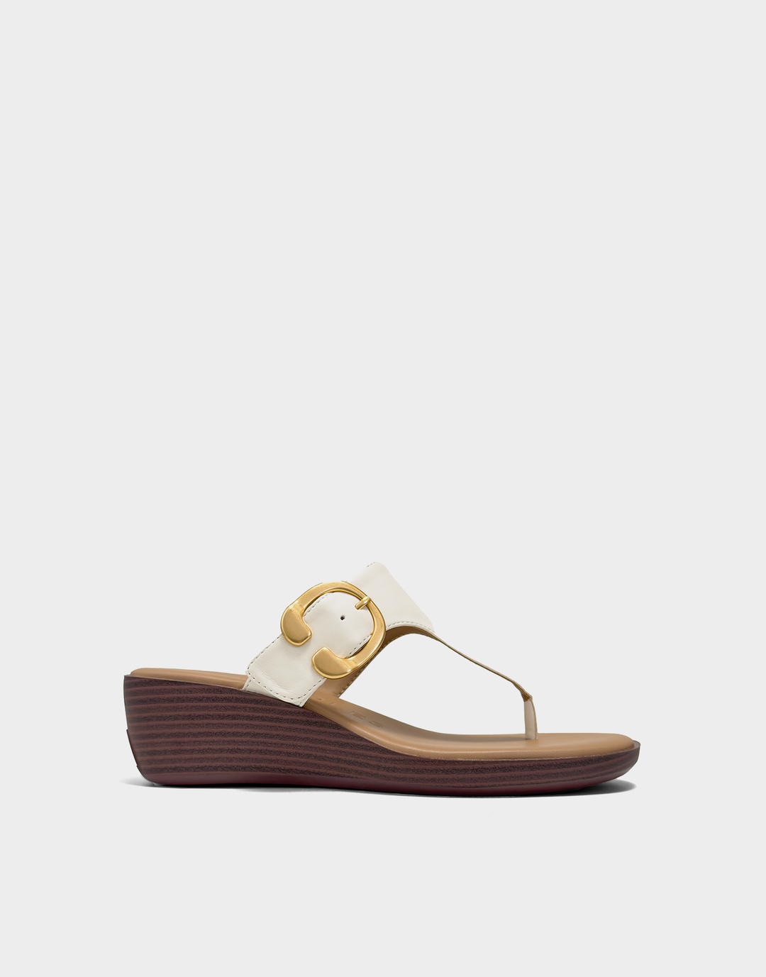 Side profile of the Aerosoles Izola wedge in Eggnog Faux Calf featuring a sleek slip-on design and a stable, medium-height wedge heel.