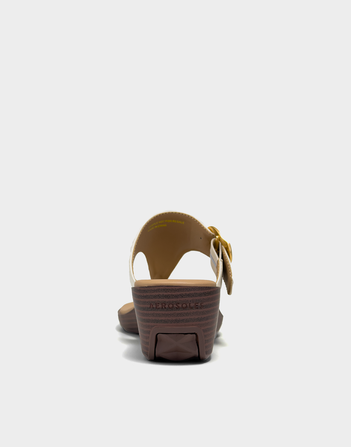 Rear view of the Aerosoles Izola wedge in Eggnog Faux Calf showcasing the sturdy wedge base and clean, elegant heel silhouette.