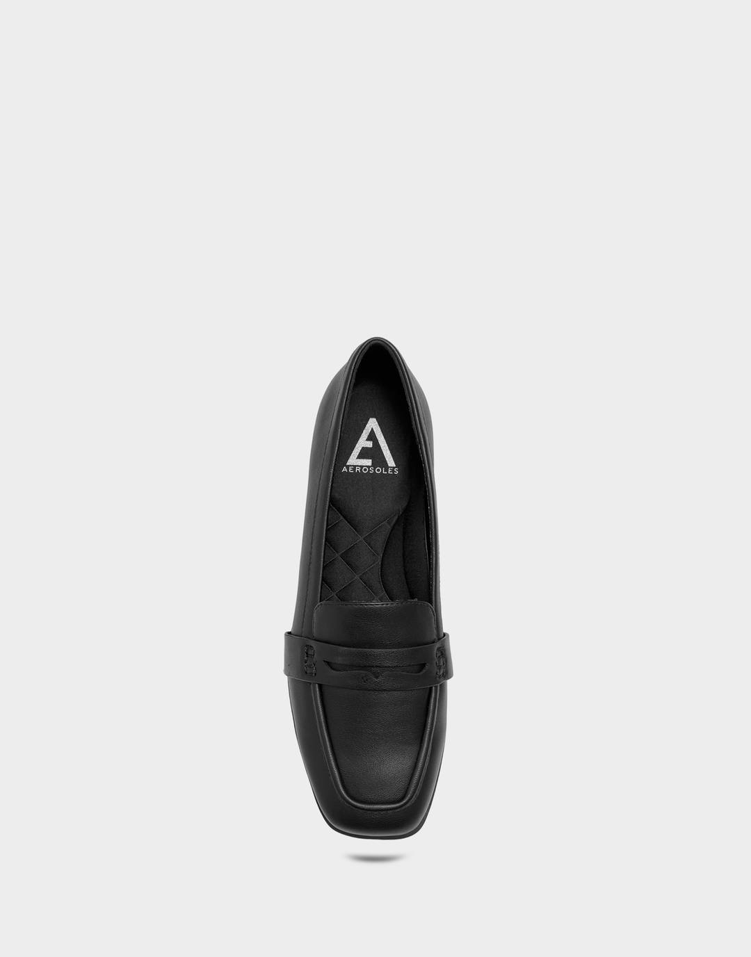 Overhead view of the Kody black loafer revealing the cushioned Ortholite® foam insole for all-day, breathable support.