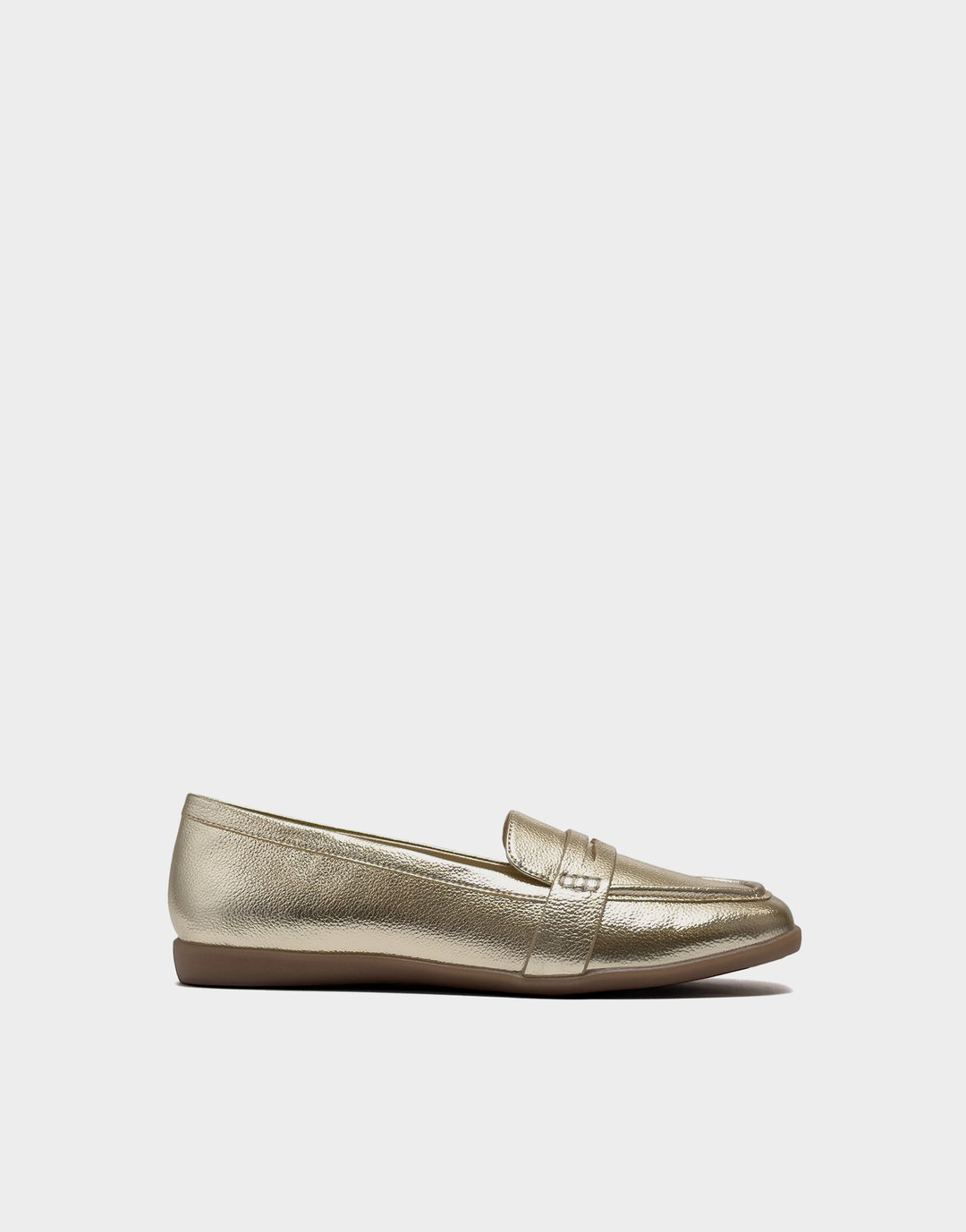 Side profile of the Aerosoles Kody loafer in Gold Metallic Faux Grain featuring a flexible step-in silhouette and a low, walkable heel.