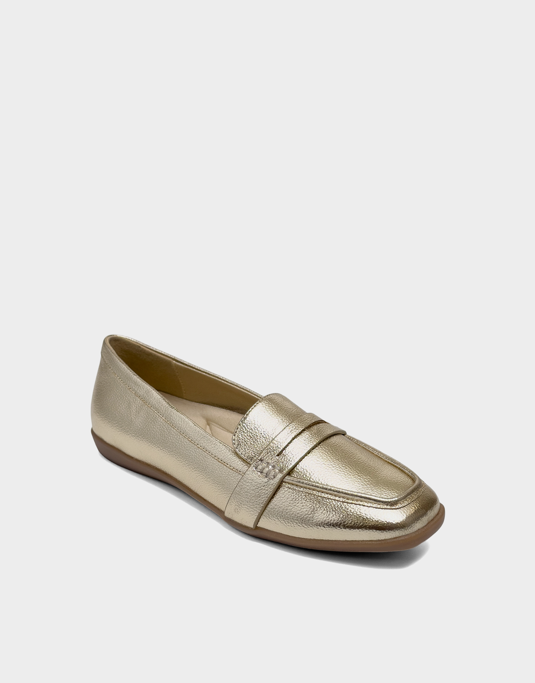 Angled view of the Aerosoles Kody gold loafer showcasing the classic penny strap and shimmering textured faux grain finish.