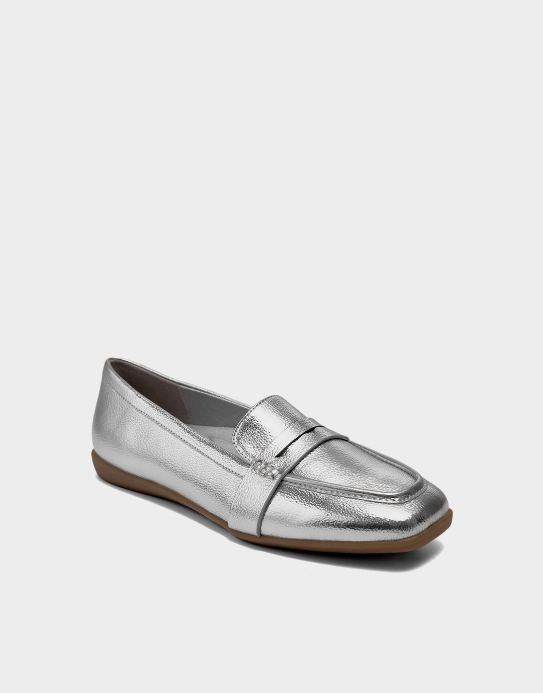 Angled view of the Aerosoles Kody silver loafer showcasing the classic penny strap and high-shine metallic textured finish.