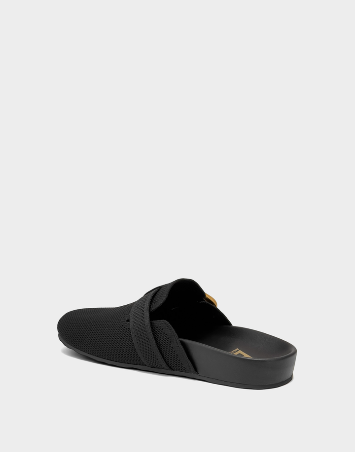 Lateral view of the Lucca knit mule highlighting the flexible upper and sleek, low-profile comfort architecture.