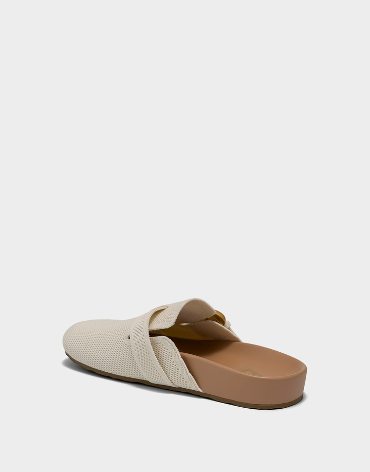 Lateral view of the Lucca knit mule in Eggnog highlighting the flexible stretch fabric and low-profile comfort architecture.