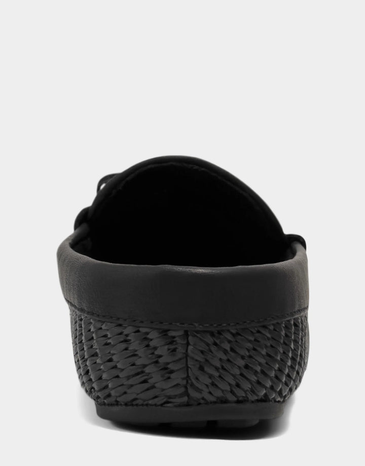 Rear view of the Daffodil loafer mule highlighting the open-back silhouette and clean, tailored finish of the heel bed.