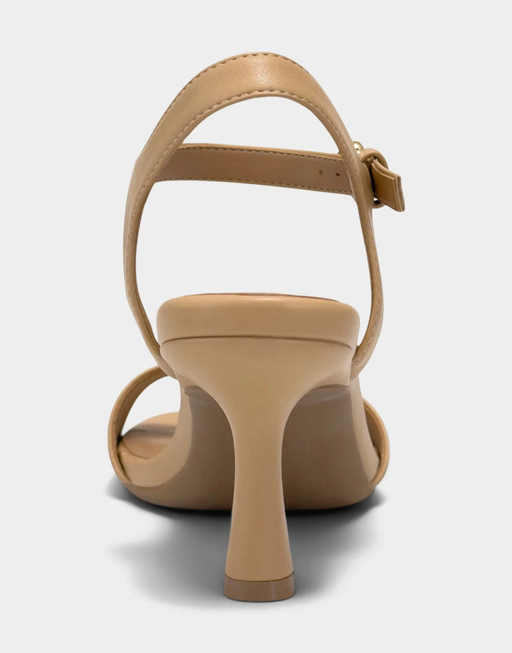 Rear view of the Aerosoles Divia in Beige Bisque showcasing the supportive heel counter and elegant, minimalist silhouette.