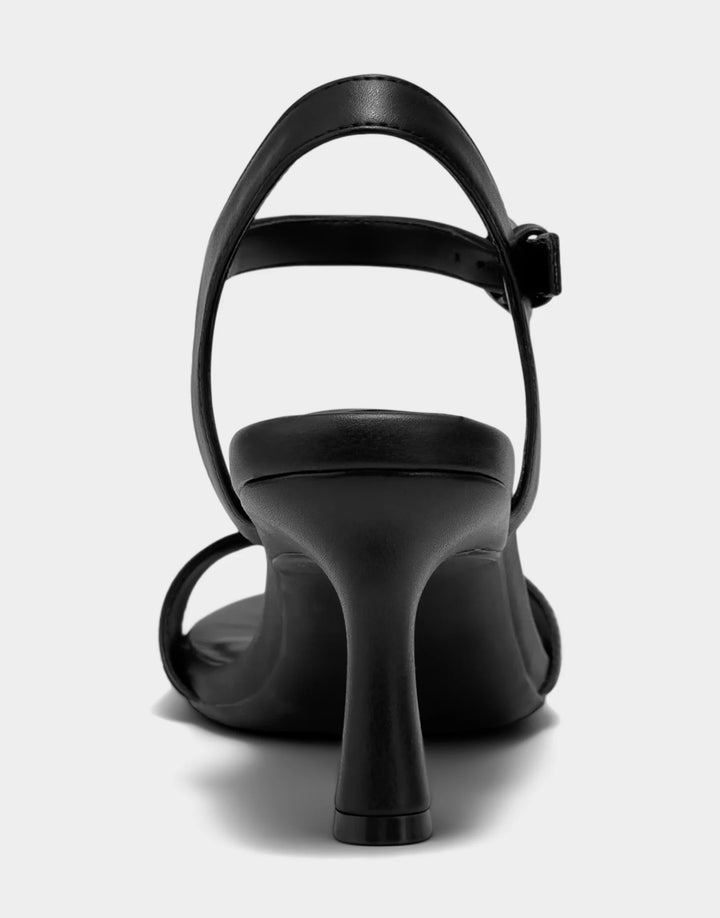 Rear view of the Aerosoles Divia in black showcasing the supportive heel counter and elegant, minimalist silhouette.